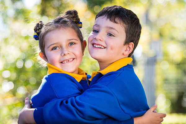 St Catherine Labouré Catholic Primary School Gymea students hugging