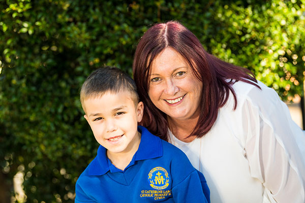 Principal of St Catherine Laboure Catholic Primary School Gymea smiling with student